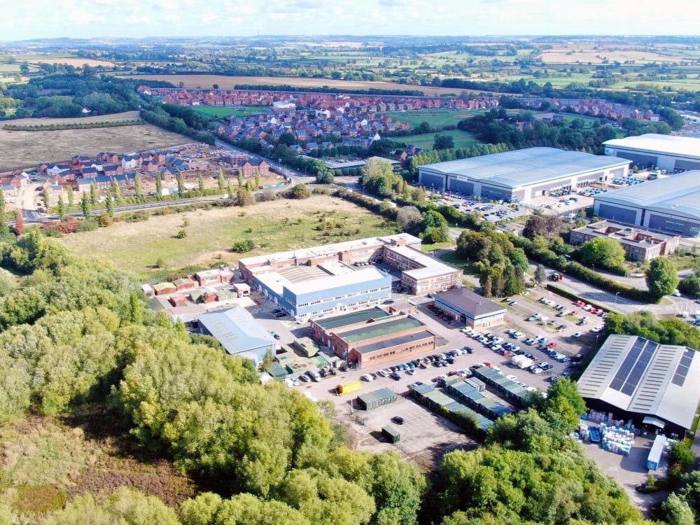 Cherwell Business Village comprises 15.89 Acre Business Park situated in Banbury, Oxfordshire at J11 of the London to Birmingham M40. The site is situated to the north of Banbury off the Southam Road opposite Logicor’s logistics park which includes tenants Amazon, The Entertainer and DCS and north of Beaumont Road Estate which includes occupiers such as Magna, Keter, Tibbets Group together with a Tesco Super Store, Banbury Cross Retail Park, Aldi and McDonalds.

The business park has a diverse range of tenants (74 total) with an opportunistic income profile with excellent prospects of continuing development of many aspects of the site. The total current net income of £725,508 per annum exclusive from a total let area of 95,973 sq ft of covered space reflecting a net rental of circa £7.58 per sq ft overall.

The site is available Freehold subject to the various leases. The main Estate and Accommodation comprising 95,973 sq ft is situated on 8.42 acres with the remaining site area totalling 7.47 acres.
We are instructed to seek offers in the region of £7 million subject to contract and plus VAT. A purchase at this level reflects a gross yield of 10.3%.