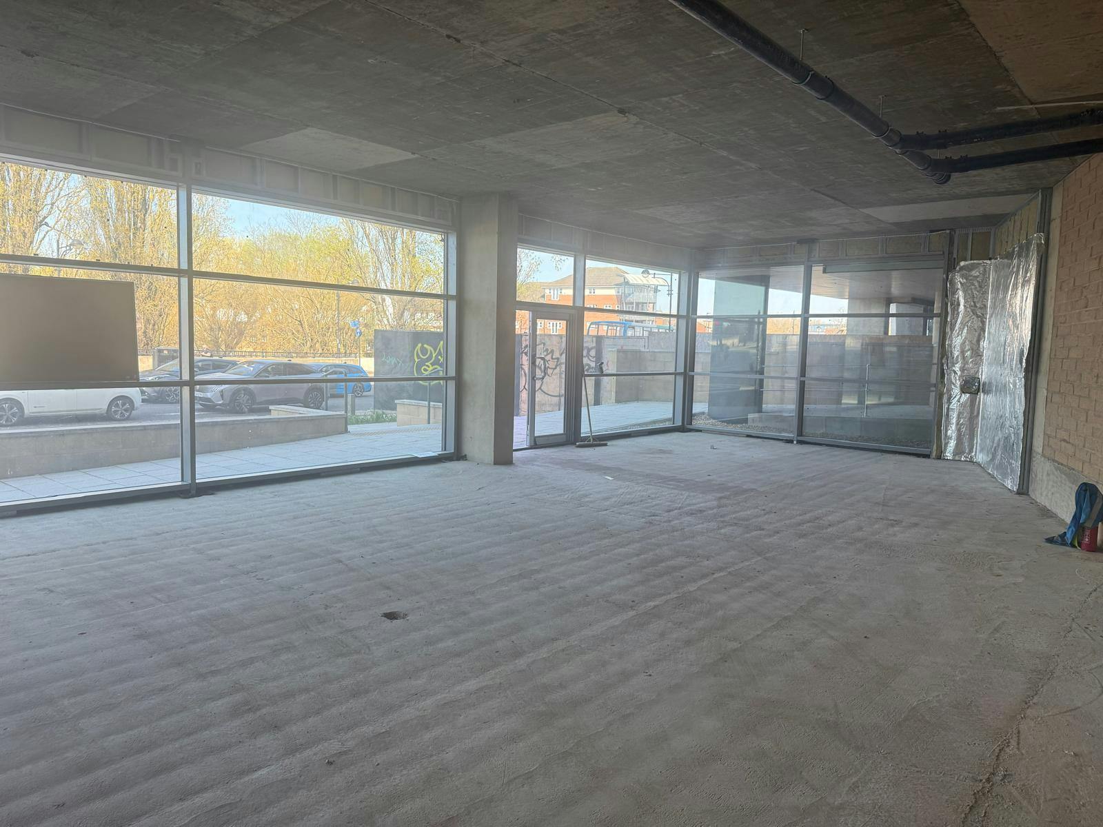 Ground floor retail unit - Armstrong House, Fletton Quays East, Peterborough, Retail To Let - Frontage.jpeg