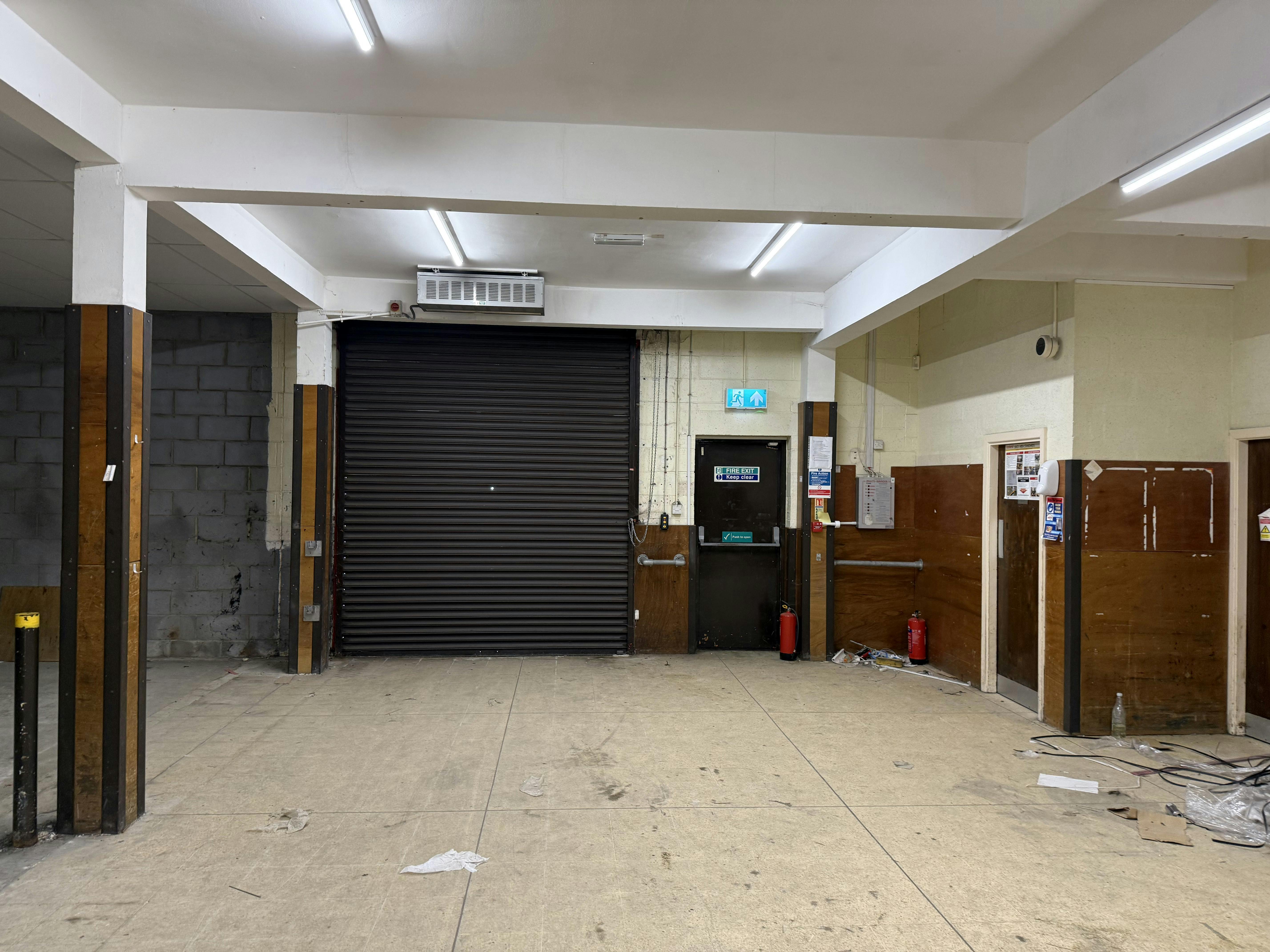 Unit 25, West Rivergate Shopping Centre, Peterborough To Let - Roller Shutter.jpg