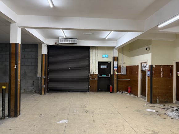 Unit 25, West Rivergate Shopping Centre, Peterborough To Let - Roller Shutter.jpg