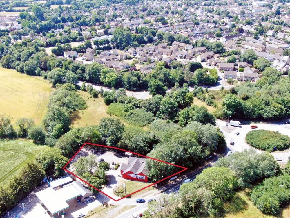 The property on-site comprises a detached ground floor retail unit (previously a Little Chef) situated on a site of 0.31 hectares (0.766 acres) fronting the A40 with car parking facilities behind on mainly tarmac of circa 34 spaces. Access and egress is via roads also used for the BP Petrol Station.

The retail unit, constructed in the 1980’s, comprises a concrete floor with traditional cavity brick block walls with some external cladding under a multi pitched roof with synthetic slate covering. Windows comprise sealed casements with security shutters. The unit has been fitted to suit the current use.