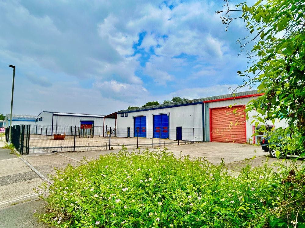 The site comprises two units, with units 9a and 9b benefitting from a self-contained fenced and secure concrete hardstanding yard area.

The buildings are each constructed around steel portal frames, incorporating concrete ground floors together with clad and block elevations, under pitched steel trussed clad and lined roofs, rolled at the eaves. Windows are of metal sealed double casement design. 9a and 9b have a height to eaves of 5.3m with a clear internal of 7.4m. 

Each of the units are provided with one electrically operated roller shutter door.