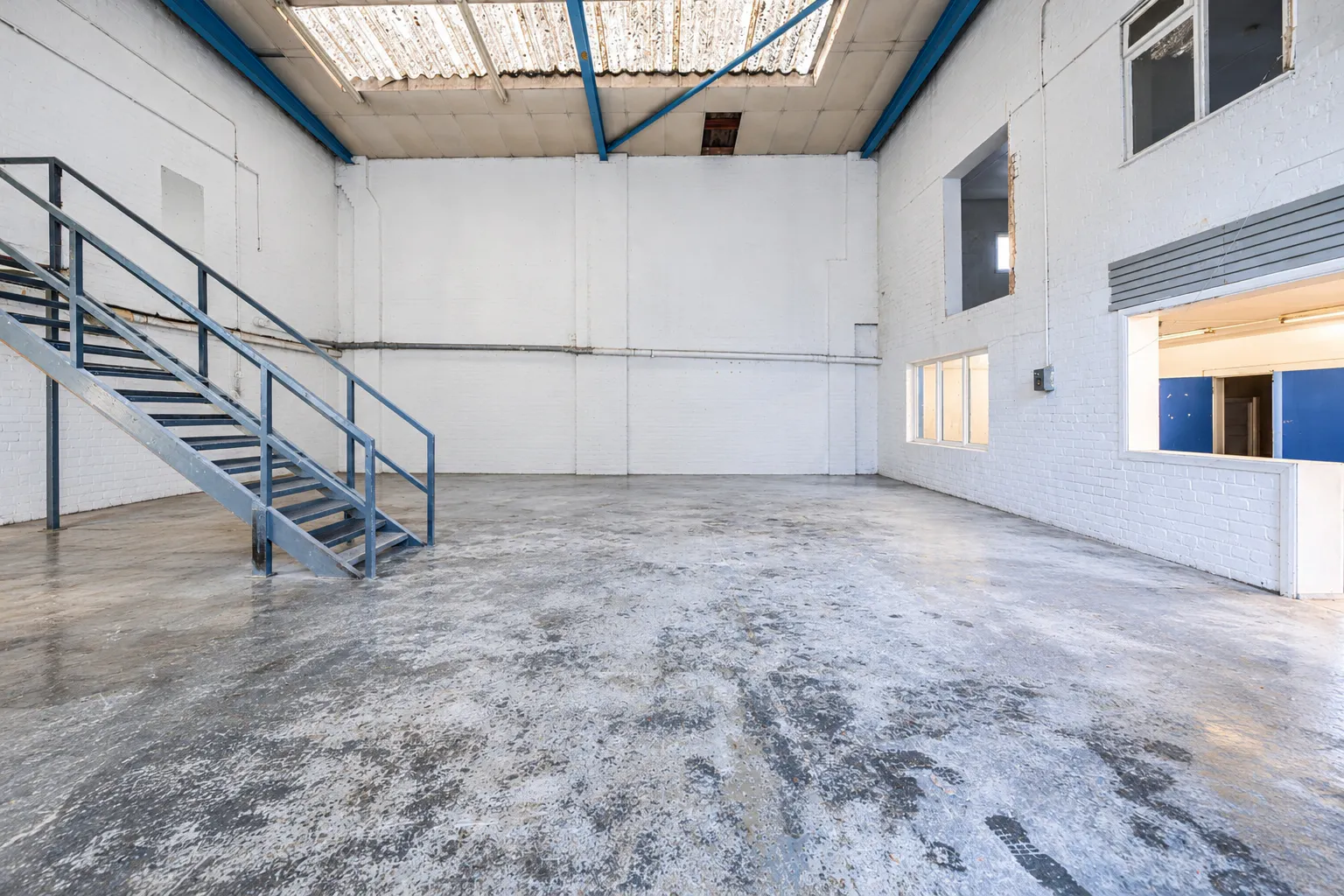 30 Oxford Road - EDIT Empty Industrial Warehouse Interior.png