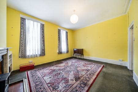 255 Gray's Inn Road, WC1X, London, Office / Residential To Let - 255 Grays Inn Road  Bright Room With Yellow Walls And Large Patterned Rug.jpg