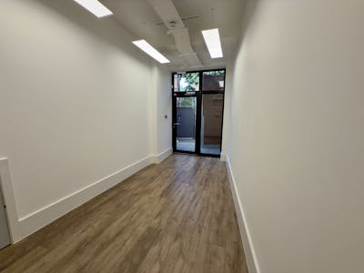 188 Tooley Street, Southwark, SE1, London, Leisure / Office / Retail To Let - 118 Tooley Street  Narrow Hallway With Wood Flooring And Glass Door.jpg