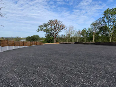 Hilfield Lane South, Bushey, Open Storage To Let - Freshly Surfaced Lot Beneath Cloudy Skies.png